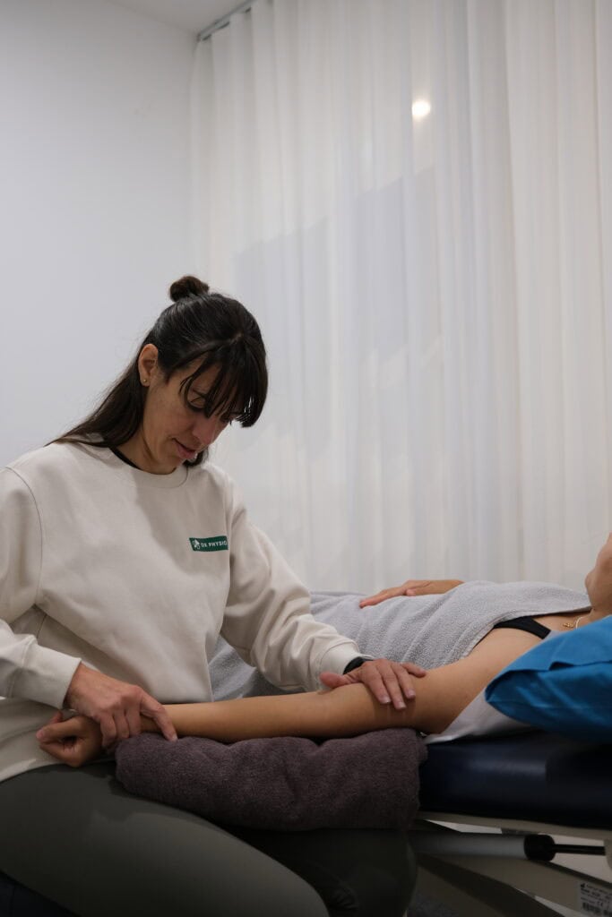 Physiotherapist performing lymphatic drainage massage at DX Physio + Reformer Pilates.